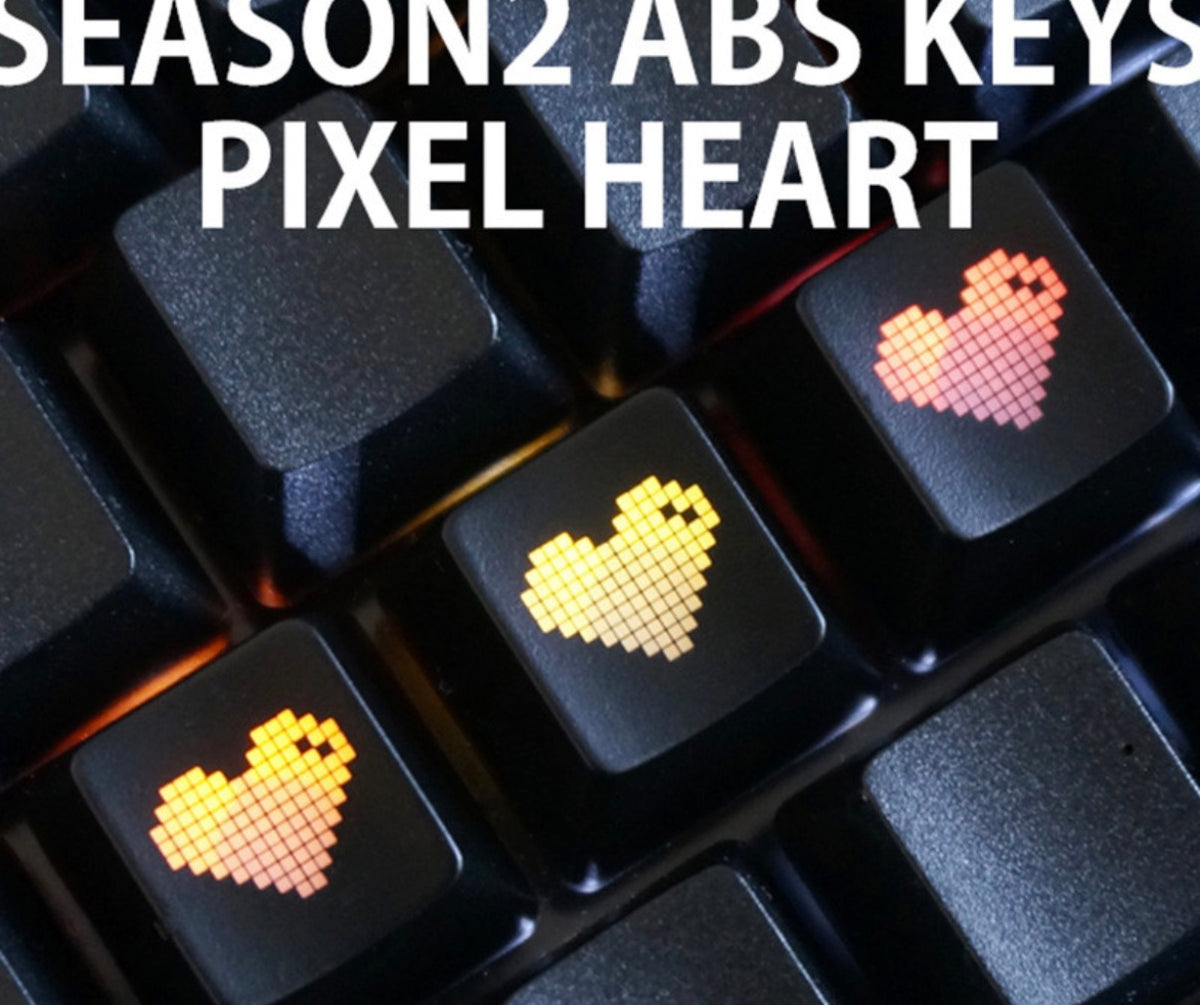 Pixel heart ABS keycaps glowing RGB on black keyboard